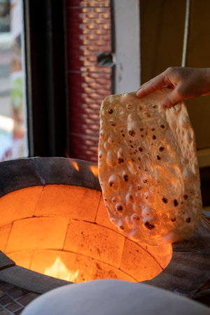 lavash bread cooked in a wood fire in a tandoor. Tandoori lavasの写真素材