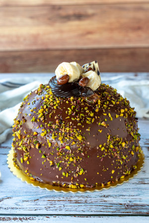 Pistachio and chocolate cake on rustic wooden background. Birthday and celebration cake. Bakery...
