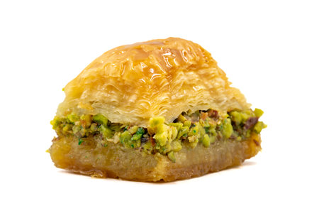 Pistachio baklava. Close-up baklava isolated on white background. Mediterranean cuisine delicaciesの写真素材