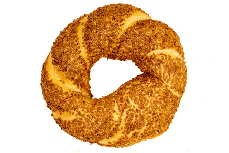 Turkish bagel or crispy. traditional flavors. Bagel with sesame isolated on white background. Top...
