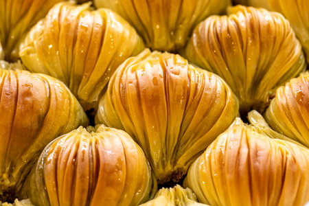 Mussel baklava with pistachio. Baklava lined up in a tray. close up