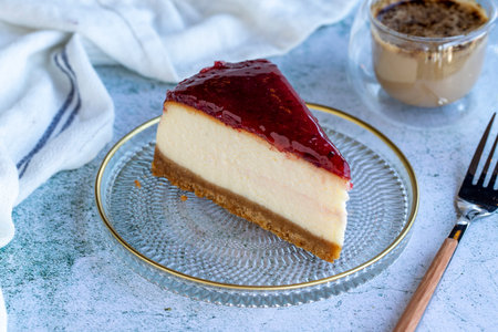 Cheesecake. Bakery products. Cheesecake with raspberry on a gray background. close upの写真素材