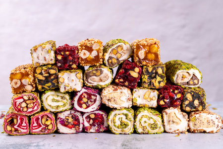Assortment of Turkish delight with pistachio on a gray background. Mixed Turkish Delight. close-up. local name suppository Turkish delightの写真素材
