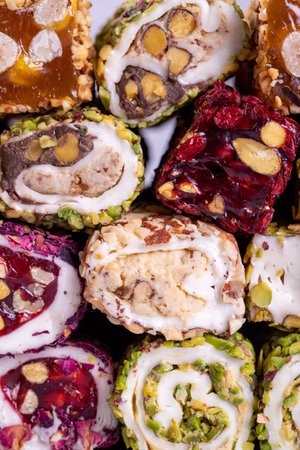 Assortment of Turkish delight with pistachio on a gray background. Mixed Turkish Delight. close-up. local name suppository Turkish delightの写真素材