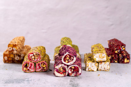 Assortment of Turkish delight with pistachio on a gray background. Mixed Turkish Delight. close-up. local name suppository Turkish delightの写真素材