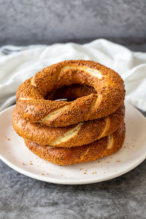 sesame bagel. Turkish bagel on dark background. Bakery products. close up