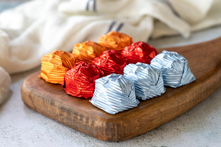 Special chocolate or gilded chocolate. Chocolates covered on gray background. Local name gilded chocolate. close upの写真素材