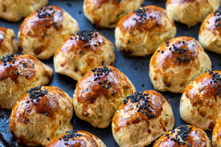 Sesame cookies. Fresh salt cookies on dark background. Bakery products. side view. close-up.