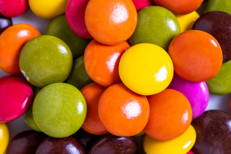 Colorful candies or bonbons. Top view of a pile of candies with chocolate filling. close upの写真素材