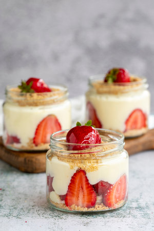 Strawberry magnolia. Dessert with cream and strawberry filling on a stone background. World cuisine...