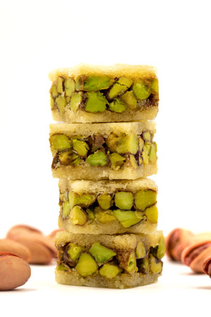 Pistachio baklava. Baklava isolated on white background. Traditional Turkish cuisine delicacies. Baklava filled with pistachio. close upの写真素材
