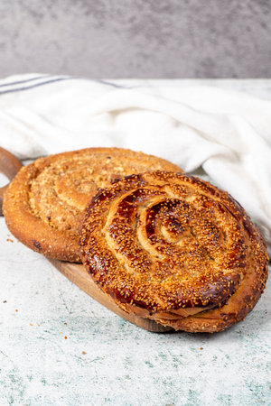 Poppy bread. Bread prepared with poppy on stone background. close up