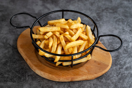 Fried potatoes. Homemade fried potatoes on a dark background. close-up