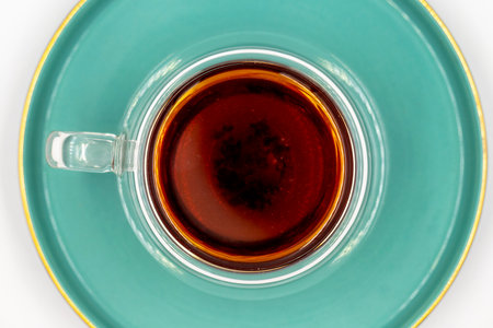 Black tea on a white background. Turkish tea brewed with hot water. close upの写真素材
