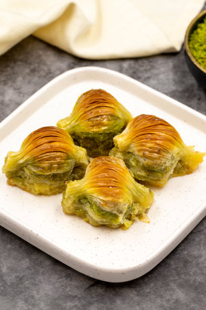Mussel baklava. Pistachio baklava on a dark background. Mediterranean cuisine delicacies. close-up. local name mussel baklavaの写真素材