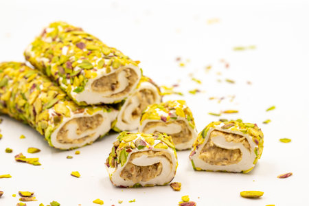 Turkish Delight with Pistachio. Turkish delight with cream filling, isolated on a white background. Traditional Turkish cuisine delicacies. close upの写真素材