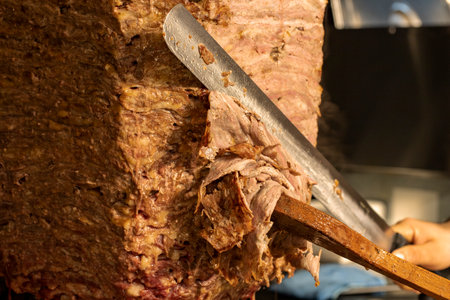 DÃ¶ner kebab. Turkish doner kebab cooked in wood fire. close up