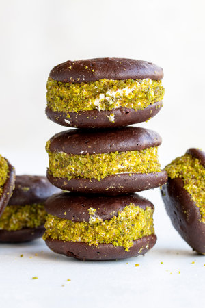 Chocolate biscuit with milk filling. Cake with milk filling on a white background. Chocolate-milk kids dessert. Bakery products. close-up. local name milk sliceの写真素材