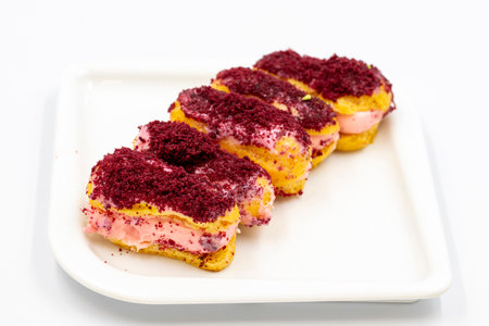 Eclair cake with raspberry isolated on white background. close-up.