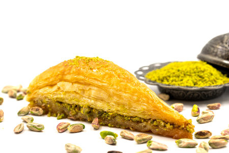 Carrot slice baklava on a white background. Traditional Mediterranean cuisine delicacies. close-up of pistachio baklava. Local name carrot slice baklavaの写真素材