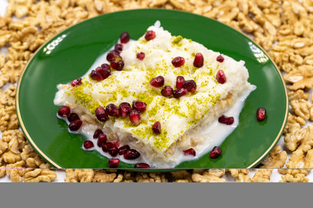 Gullac dessert. Traditional Turkish dessert sprinkled with walnuts. Gullac is a dessert made with milk. close upの写真素材