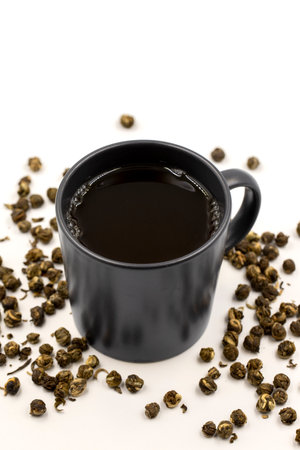 Jasmine Pearls Green Tea on a white background. medicinal asian herbal tea