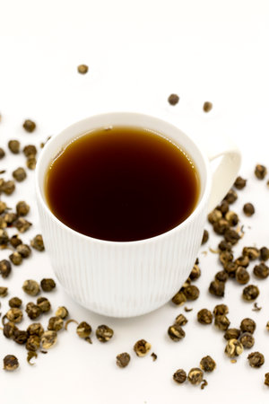 Jasmine Pearls Green Tea on a white background. medicinal asian herbal tea