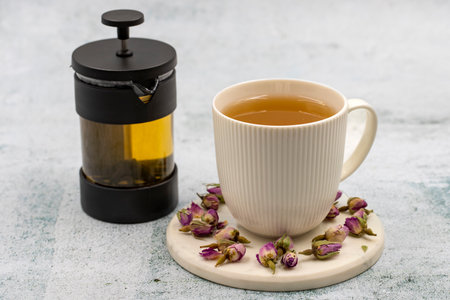 Bud Rose Tea on a stone background. Medicinal herbal tea.