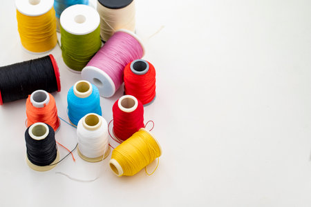 Different colored yarn on white background