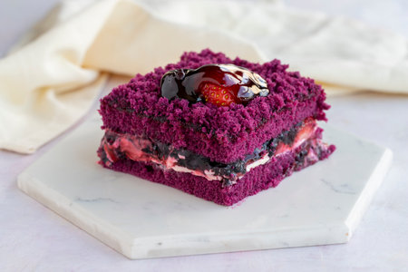 Homemade forest fruit cake on a white wooden background
