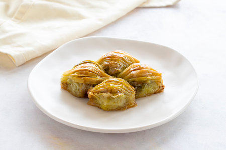 Mussels baklava Turkish pistachio baklava on a white background. Local name mussel baklavaの写真素材