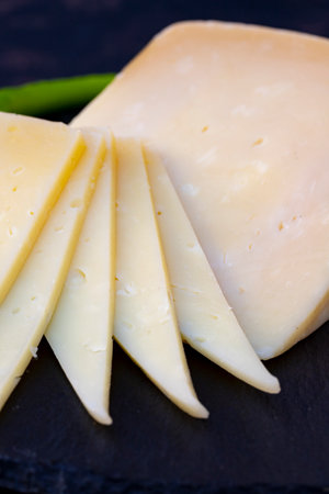 Kashar cheese or kashkaval cheese. Sliced Cheddar Cheese. gourmet cheese local name Thrace Cheddar...