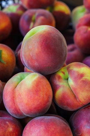 close-up ripe peaches on the market stallの写真素材