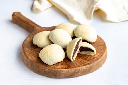 Cookies with chocolate filling on a white background. Freshly baked cookiesの写真素材