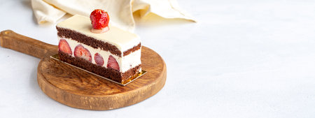 Slice of strawberry cake on a white background. copy spaceの写真素材