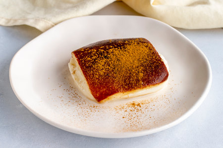 Fried milk dessert on a white background. Turkish dessert Kazandibi