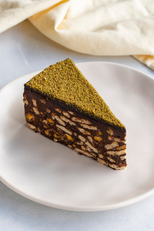 Pistachio mosaic cake on a white backgroundの写真素材