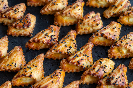 Freshly baked savory cookies on trayの写真素材