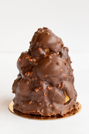 Profiterole tower cake on a white background.の写真素材