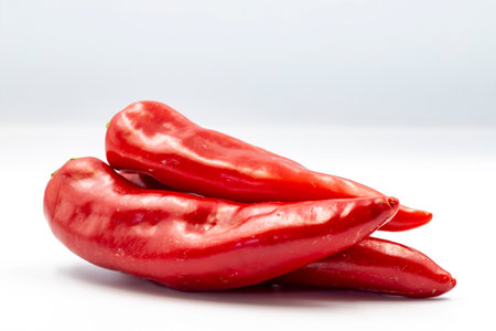 Fresh red pepper on white background with shadow. close upの写真素材