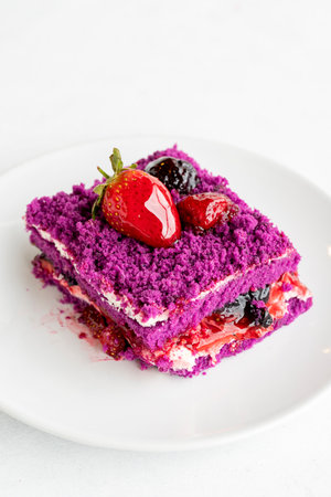 Forest fruit cake on a white background. Turkish sweet dessert concept. plate of sliced forest fruit cake. Mediterranean bakery. close up. selective focus. Horizontal view.の写真素材