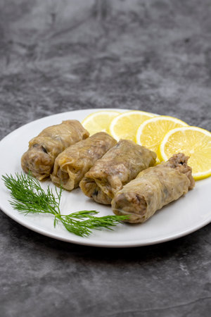Stuffed cabbage leaves, in a ceramic plate. Vegan cabbage rolls, cooked cabbage leaves, wrapped...