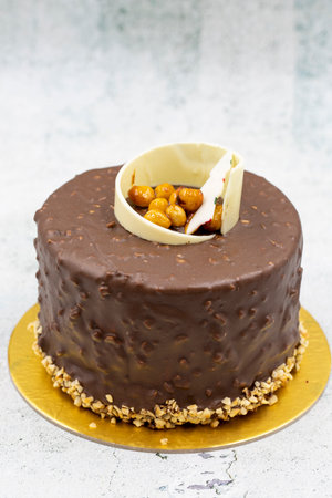 Celebratory chocolate cake on a stone background. Pastry products. close up