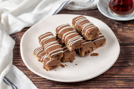 Chocolate covered cookies. Bakery products. Chocolate cookies on wood background. close up