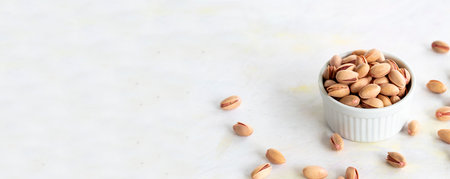 pistachios - on a white wooden background