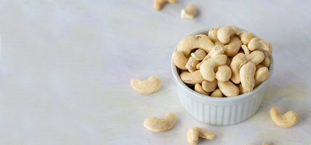 cashew on wooden background - cashew