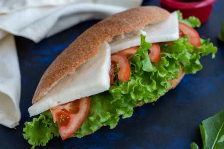 sandwich with feta, tomato, lettuce, arugula among whole-wheat bread - quick snack tasty sandwichの写真素材