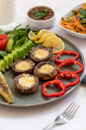 cheddar mushrooms - baked cheddar mushrooms on a white backgroundの写真素材