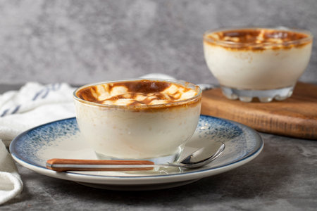 rice pudding Traditional Turkish cuisine desserts. Rice pudding dessert made with milk, sugar and...