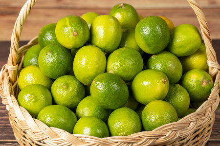 lemon Pile of lemons in basket on wood backgroundの写真素材